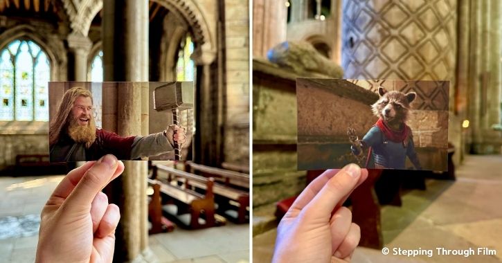 Man holds of images of Avengers Endgame movie scenes on background of Durham Cathedral, which was used as a filming location.